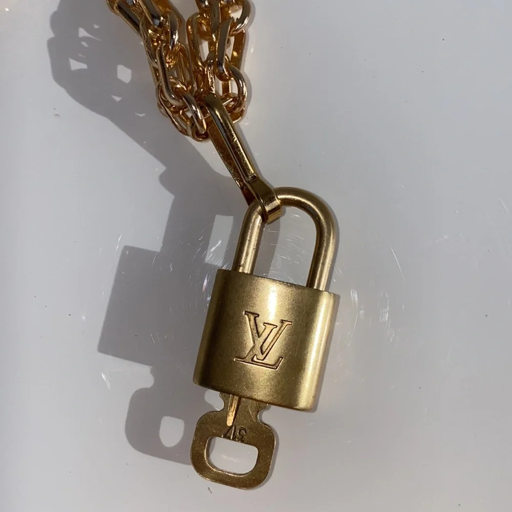 Authentic Louis Vuitton Lock and Key Set on a Chain. - Picture 9 of 10